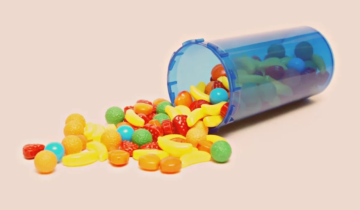 colorful-candy-spilling-out-of-pill-bottle-524921545